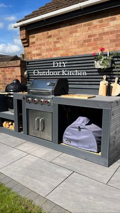 an outdoor kitchen built into the side of a building