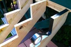 a close up of a light on a wooden deck