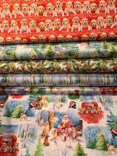 four different fabrics with dogs and christmas trees on them, all printed in red and green