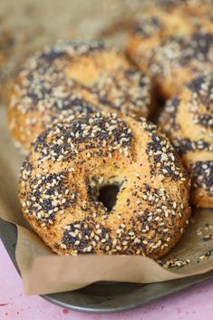 bagels with sesame seeds are on a plate