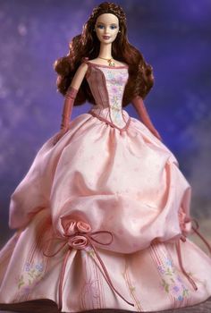 a barbie doll wearing a pink dress and tiara