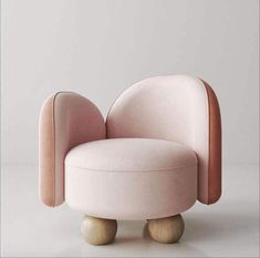 a pink chair sitting on top of a wooden base