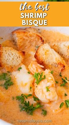 the best shrimp bisque recipe is in this bowl with bread and parsley on top