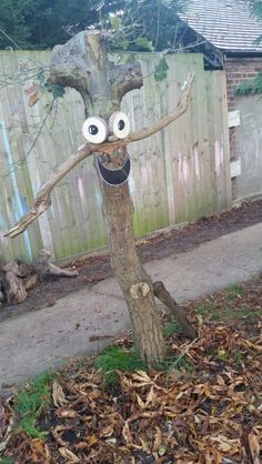 a tree that has been decorated with googly eyes