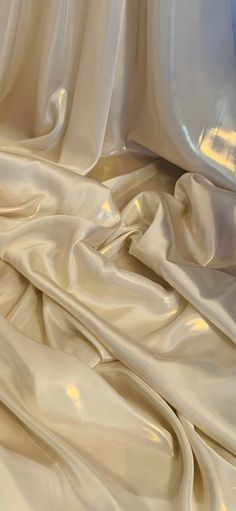 Our shimmer satin has a superior drape like no other. This luxurious fabric has a soft touch and glows beautifully creating a perfect blend between the shimmer and satin. Perfect for all types of dressmaking, crafting, decorating and various other projects.  *Colours may vary due to different screens.  *Width 58 inches *Synthetic *Machine Washable *If you order more than 1 meter, fabric will come as one continuous length. *Fast Delivery Before you go please check out our other items. We offer combined postage and special delivery. Lastly, we would appreciate if you can leave us feedback once items are received. Thank you. Liquid Gold Aesthetic, Liquid Satin Dress, Ethereal Elegance, Crushed Velvet Fabric, Gold Color Palettes, Diamond Ice, Beaded Tulle, Gold Aesthetic, Fashion Sketchbook