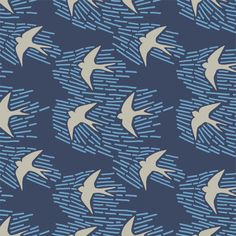 a flock of birds flying in the sky with blue and white lines on it's sides