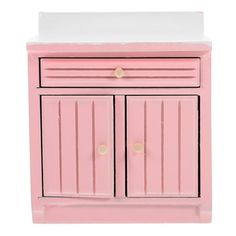 a pink cabinet with two doors and drawers