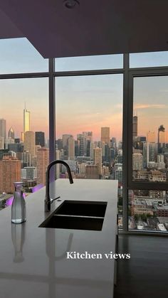 a kitchen with a view of the city