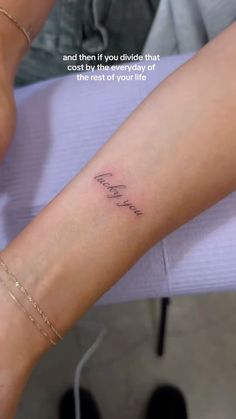 a woman's foot with the word love tattooed on her left leg and an inscription that reads, and then if you divide that means