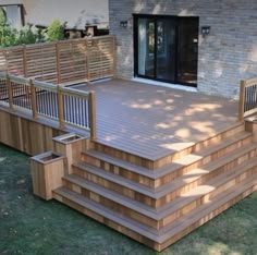 a large wooden deck with steps leading up to it