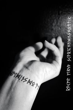 a person's arm with the word maximum tattooed on their left wrist and hand