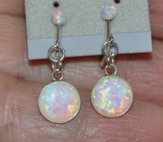 "Shop Clip On Screw Back Opal Earrings Sterling Silver, White Opal Non Pierced Dangle Earrings, Bohemian Bridal Opal Jewelry Looking for some unique earrings for non pierced ears? These clip-on opal earrings are the perfect fit. They will add a sparkle to your special occasion or everyday dress. These opal screw back earrings are made from: - Sterling silver adjustable screw back findings - 8mm lab created white opal cabochons - Sterling silver bezels - Sterling silver jump rings - 3mm lab creat Jewelry Girl, Bohemian Bridal, Everyday Dress, Opal Earrings Stud, Opal Studs, Earrings Bohemian, Opal Bracelet, Opal Earrings, Girls Earrings