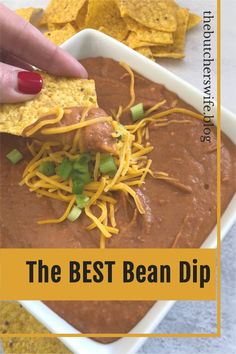 the best bean dip with tortilla chips in a white bowl and text overlay that reads, the best bean dip