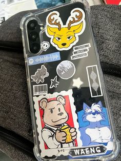 an iphone case with various stickers on it