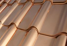 a close up view of a metal roof with wavy lines on the top and bottom