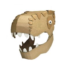 a paper model of a dinosaur head with its mouth open and teeth wide open, on a white background