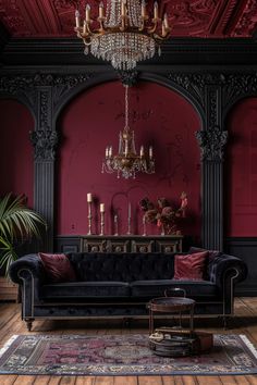 an elegant living room with red walls and chandelier