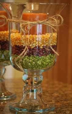 two glass vases filled with candy and candies