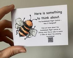 someone holding up a card with a bee on it that says, here is something to think about