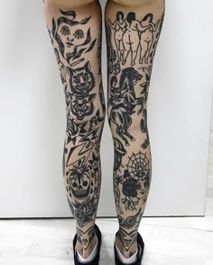 the legs and ankles of a woman with tattoos