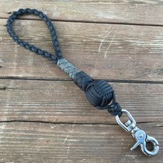 a black lanyard with a metal hook on it