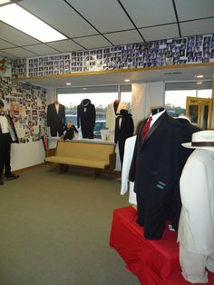 men's suits and ties are on display in an office