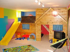 a child's play room with a slide and slides