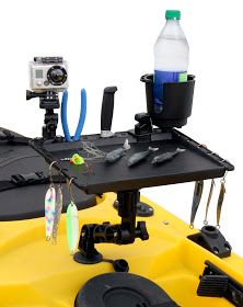 a yellow kayak with fishing equipment on it and a camera attached to the back