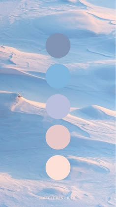 a poster with five circles on it in the middle of a snow covered field,