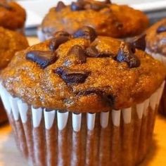 chocolate chip muffins sitting on top of a table