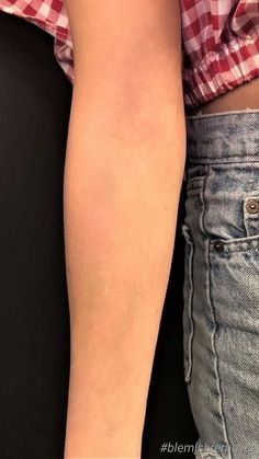 a woman's arm with a tattoo on it