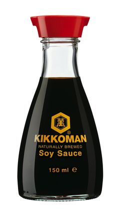 kikoman soy sauce in a glass bottle with red cap on the top and bottom