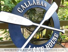 there is a sign that says calahhan lake house on the side of a fence