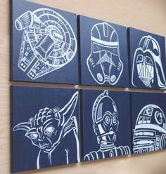 four star wars paintings are hanging on the wall