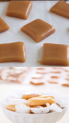 there are several pieces of caramel in the bowl and on the table next to each other