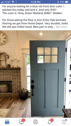 the front door is painted blue with white trim