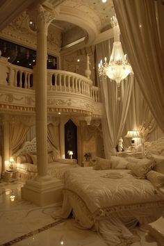 a large bed sitting under a chandelier next to a white couch in a bedroom