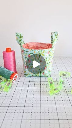 sewing supplies on a table with scissors and spools