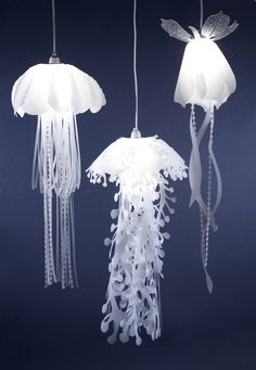 three white jellyfish lights hanging from strings