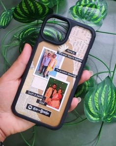 a person holding up a cell phone case with photos on it and green leaves in the background