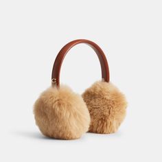 Perfect for ski days and city adventures these warm earmuffs feature super soft long-haired shearling. The smooth leather headband is accented with our Signature for a heritage touch. | Coach Shearling Earmuffs - Women's - 1941 Saddle Signature For A, Apres Ski Style, Coach Scarf, Leather Headband, Leather Headbands, Coach Belt, Ski Fashion, Chic Gifts, Monogrammed Items