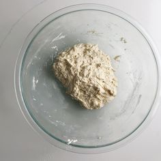 a rock in a glass bowl on a table