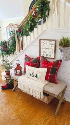 a bench with pillows and christmas decorations on it