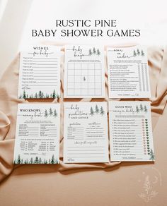 the rustic pine baby shower games are laid out on a bed