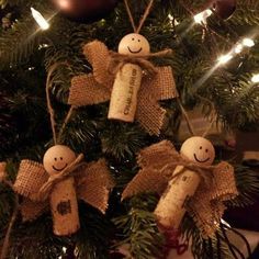 an ornament hanging from the top of a christmas tree decorated with burlocks and twine