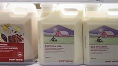 three gallon jugs of bed time milk are on display in a grocery store shelf