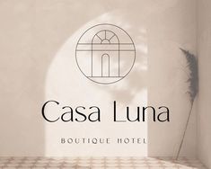 the logo for casa luna boutique hotel is shown in front of a white wall