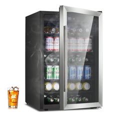 an empty beverage cooler next to a glass filled with sodas and drinks on a white background