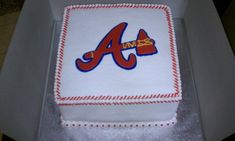 the cake is decorated with an atlanta braves logo on it's frosting sheet