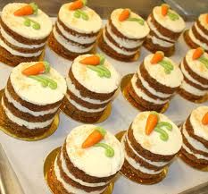 there are many small cakes with carrots on them